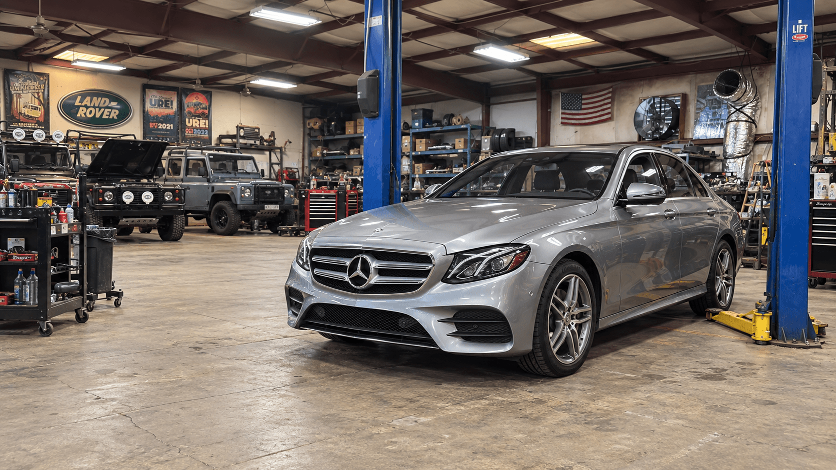 Illustrative silver Mercedes-Benz sedan in a workshop